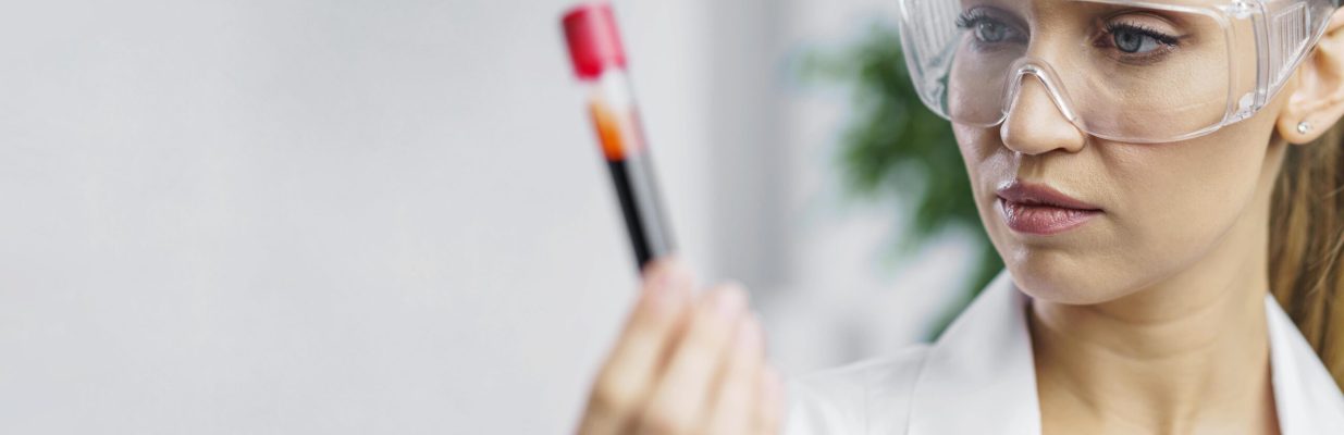 portrait-female-researcher-lab-with-test-tube-copy-space